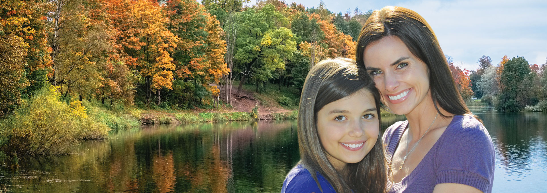 mother and daughter by lake