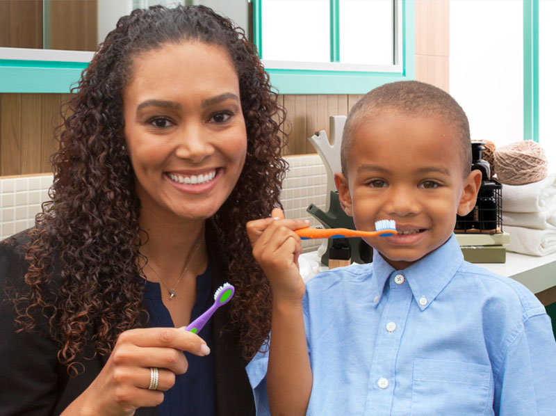 mother and son with toothbrushes