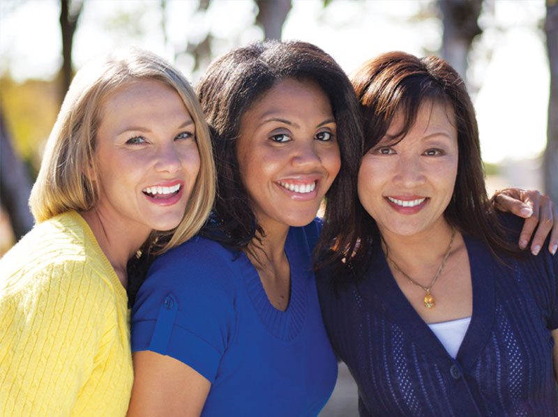 Three smiling women